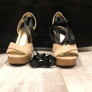 Tan and black tie up wedges